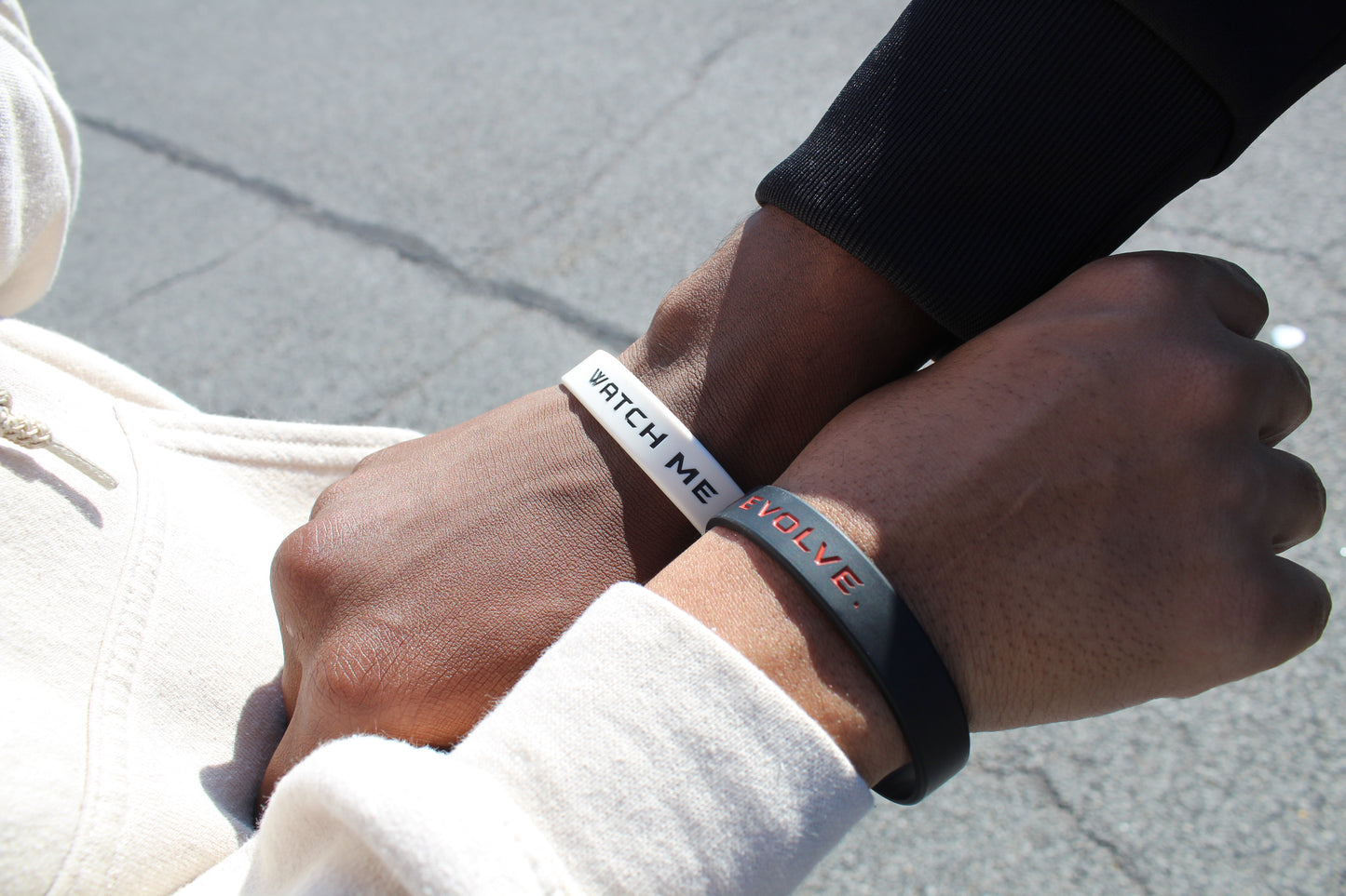 "Watch Me Evolve." Black Wristbands