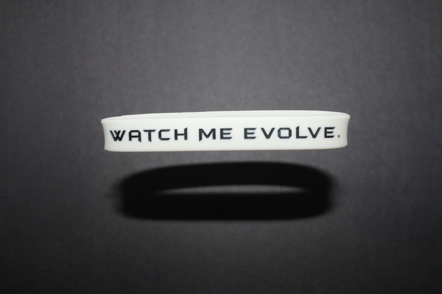 "Watch Me Evolve." White Wristbands